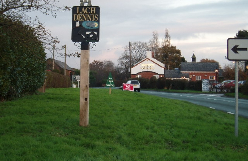 Lach Dennis village sign post