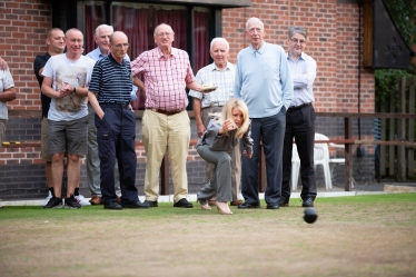Esther tries her hand at bowling on the club's Green